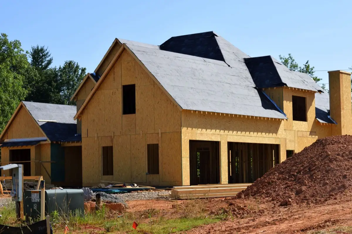 House with new roof decking and synthetic underlayment during a roof replacement in League City, TX